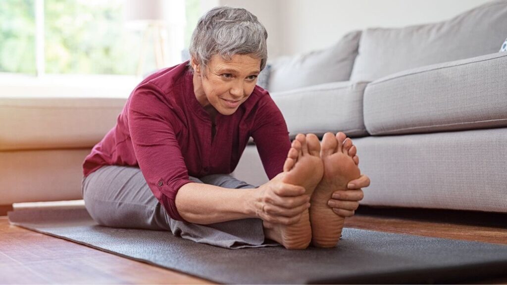Doing stretching to relieve cramps